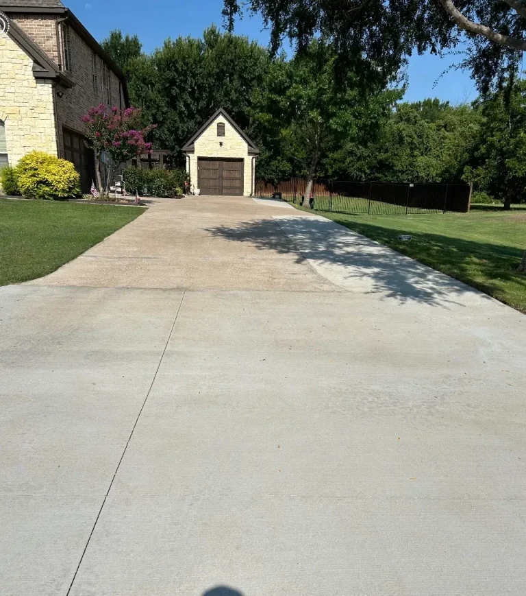 Clean concrete driveway after pressure washing in Arlington, TX