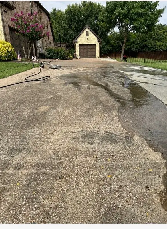 Dirty concrete driveway before pressure washing in Arlington, TX