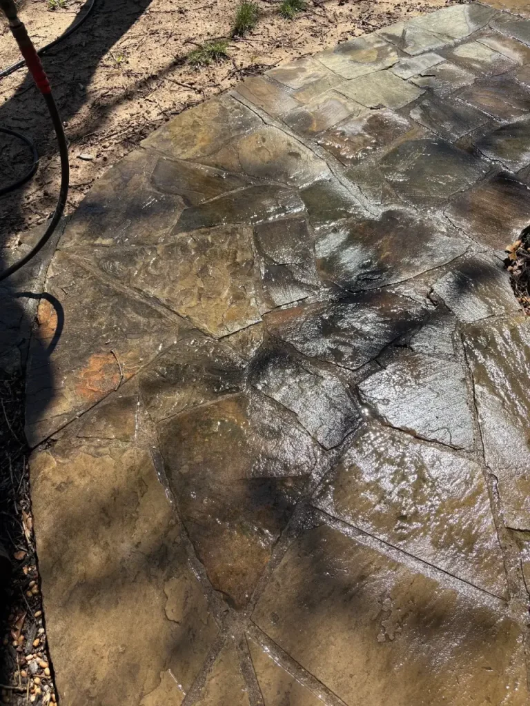 Flagstone walkway being cleaned