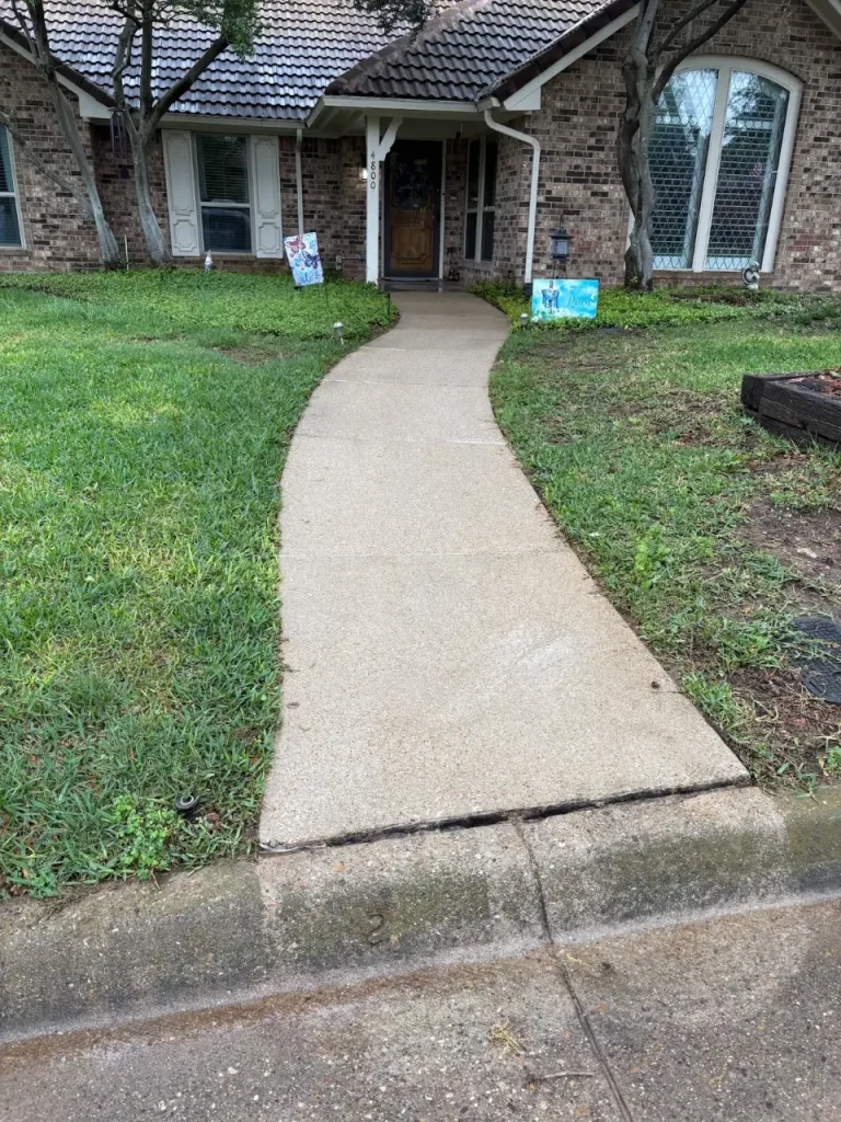 Front concrete walkway after pressure washing