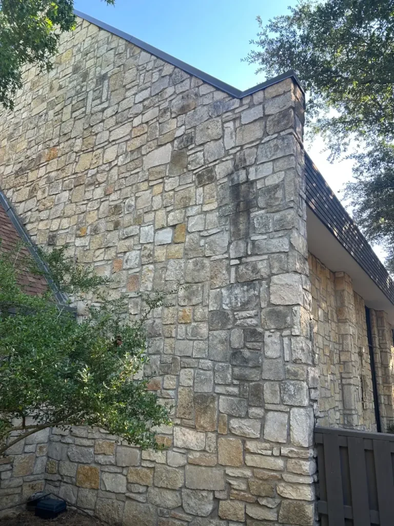 Tall stone exterior wall cleaning project